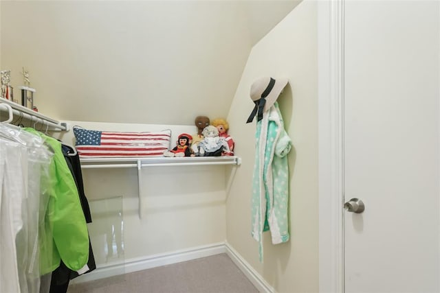 368 Millbrook Dr, Norman, OK 73072 - unfurnished bedroom featuring carpet floors, vaulted ceiling, and baseboards
