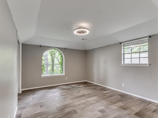 unfurnished room featuring wood finished floors and baseboards