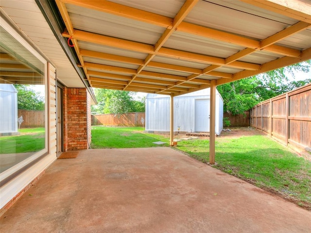 7700 Wegner Way, Oklahoma City, OK 73162 - view of patio / terrace with a storage unit and an outdoor structure