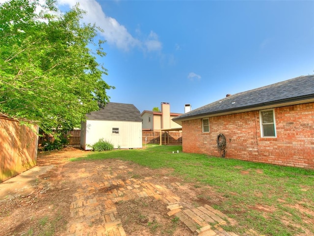 7700 Wegner Way, Oklahoma City, OK 73162 - view of yard featuring a storage unit and an outbuilding