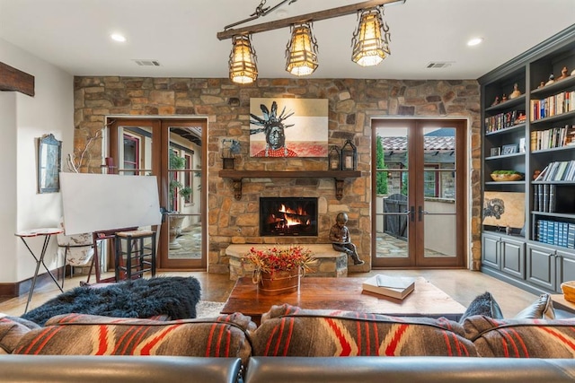 9639 Horizon Cir, Sperry, OK 74073 - living room featuring a stone fireplace, french doors, and visible vents