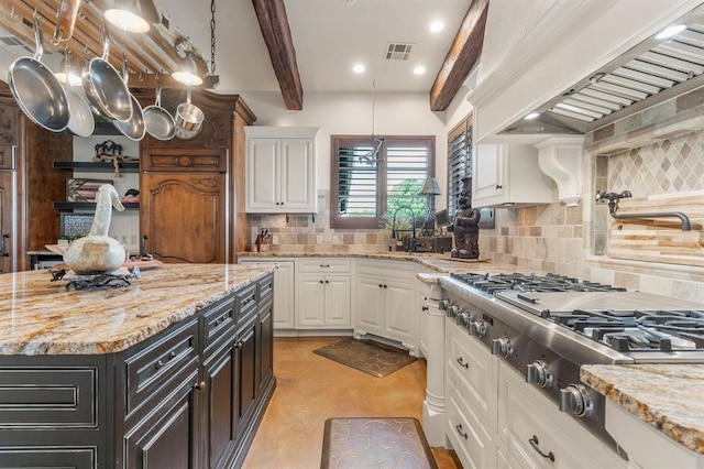 9639 Horizon Cir, Sperry, OK 74073 - kitchen featuring white cabinetry, visible vents, and backsplash