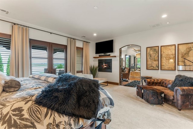 9639 Horizon Cir, Sperry, OK 74073 - carpeted bedroom with arched walkways, visible vents, and recessed lighting