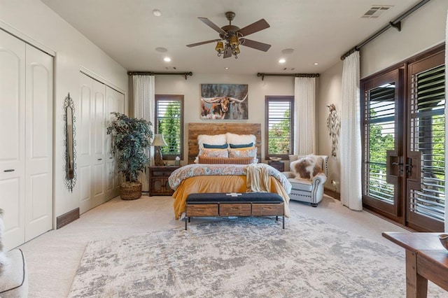 9639 Horizon Cir, Sperry, OK 74073 - bedroom with two closets, carpet flooring, access to outside, and visible vents