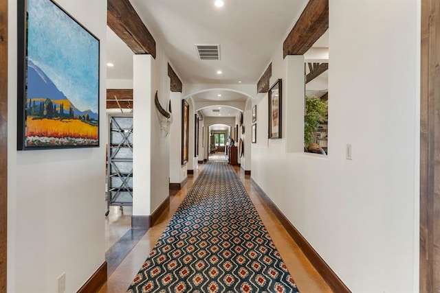 9639 Horizon Cir, Sperry, OK 74073 - corridor with arched walkways, baseboards, visible vents, and recessed lighting