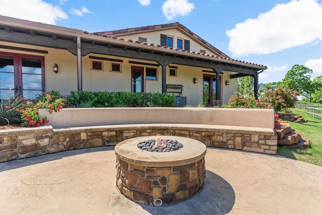 9639 Horizon Cir, Sperry, OK 74073 - back of property with a patio area, stucco siding, and a fire pit