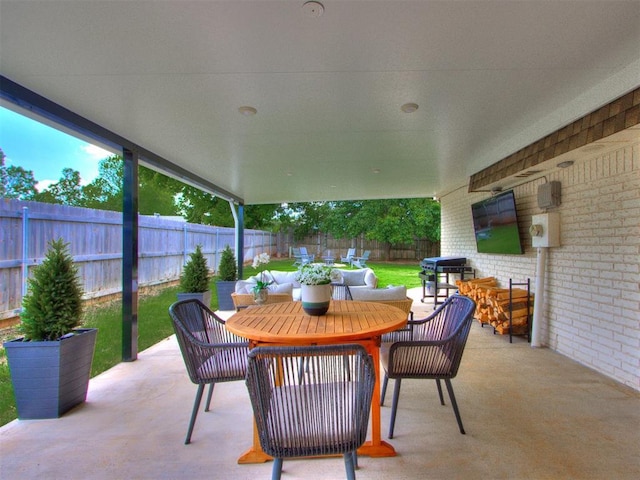 11825 Leaning Elm Rd, Oklahoma City, OK 73120 - fenced backyard with outdoor dining space, a patio area, and a grill