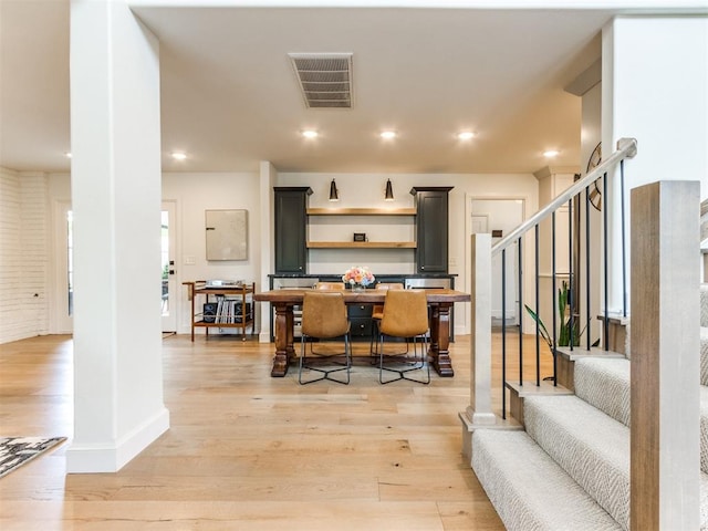 11825 Leaning Elm Rd, Oklahoma City, OK 73120 - dining room with light wood-style flooring, stairway, and recessed lighting