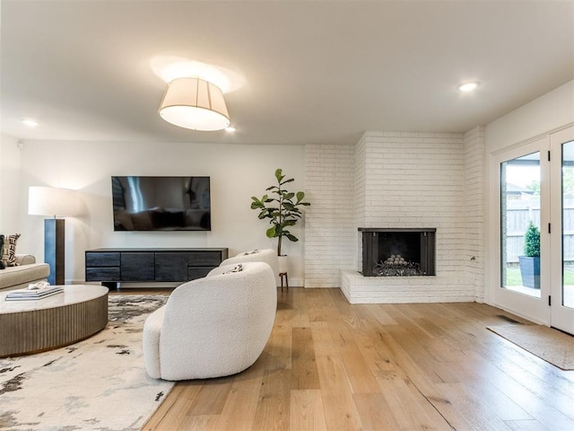 11825 Leaning Elm Rd, Oklahoma City, OK 73120 - living room with a fireplace, hardwood / wood-style flooring, and recessed lighting