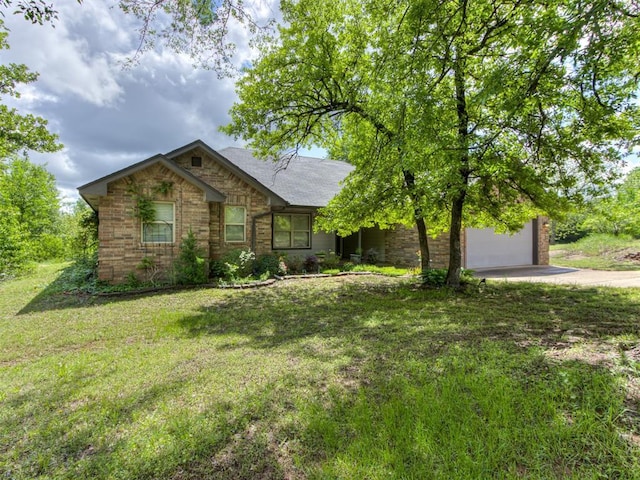 20140 N Rolling Meadows Dr, Luther, OK 73054 - view of front of house with driveway, a front yard, a garage, and brick siding