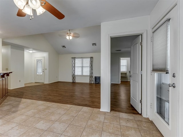 20140 N Rolling Meadows Dr, Luther, OK 73054 - foyer with a ceiling fan, light tile patterned floors, vaulted ceiling, and baseboards