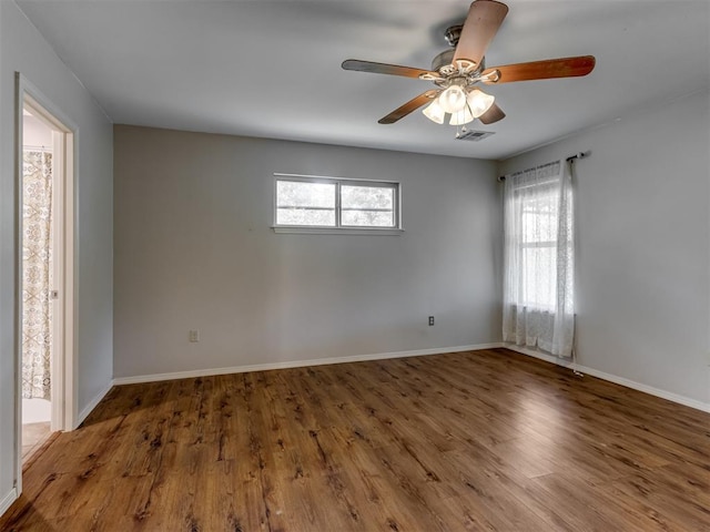20140 N Rolling Meadows Dr, Luther, OK 73054 - unfurnished room with plenty of natural light, wood finished floors, and a ceiling fan