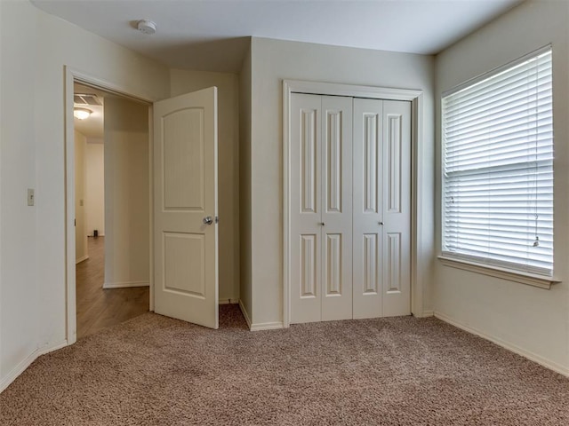 20140 N Rolling Meadows Dr, Luther, OK 73054 - unfurnished bedroom featuring carpet, a closet, and baseboards