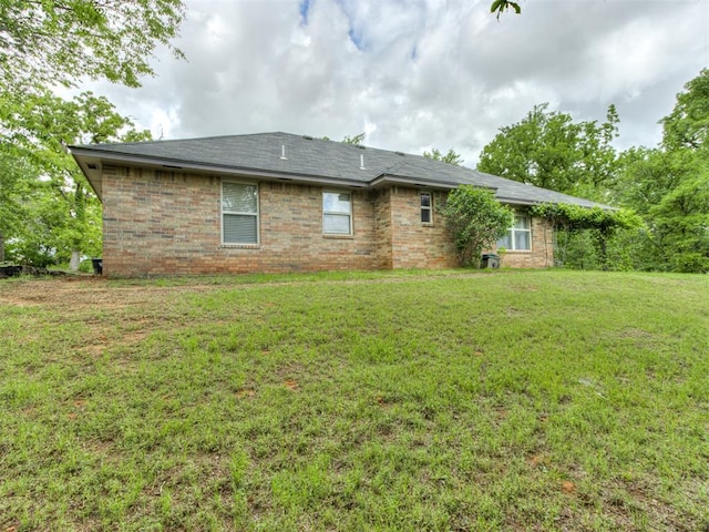 20140 N Rolling Meadows Dr, Luther, OK 73054 - rear view of property featuring a lawn and brick siding