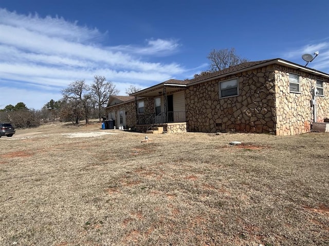 6300 S Hiwassee Rd, Oklahoma City, OK 73150 - view of home's exterior featuring stone siding