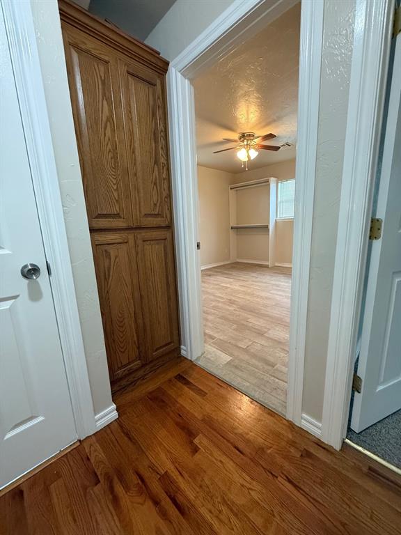 6300 S Hiwassee Rd, Oklahoma City, OK 73150 - hallway with light wood-style flooring and baseboards