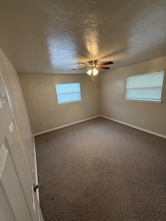 6300 S Hiwassee Rd, Oklahoma City, OK 73150 - spare room featuring carpet flooring, ceiling fan, and baseboards