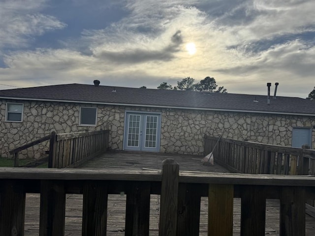 6300 S Hiwassee Rd, Oklahoma City, OK 73150 - back of property featuring french doors, a deck, stone siding, and roof with shingles
