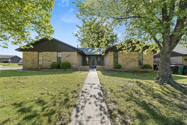 9800 Honeysuckle Rd, Oklahoma City, OK 73159 - view of front of house featuring brick siding and a front yard