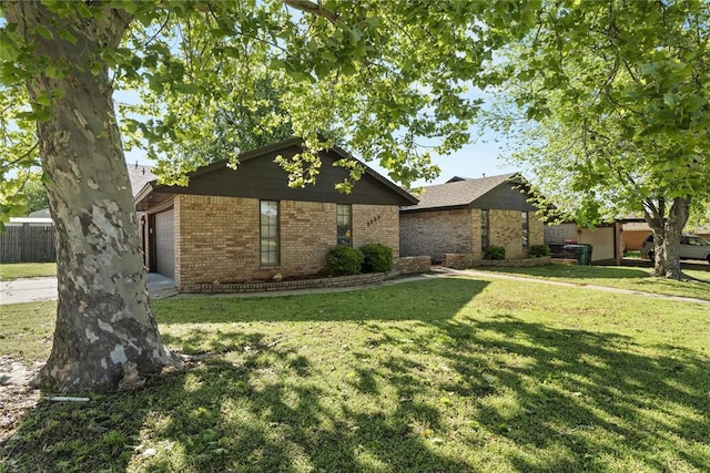9800 Honeysuckle Rd, Oklahoma City, OK 73159 - view of front of home featuring brick siding and a front lawn