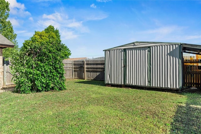 9800 Honeysuckle Rd, Oklahoma City, OK 73159 - view of yard featuring a fenced backyard and an outbuilding