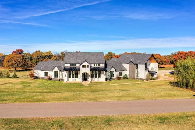 7217 Painted Sky Dr, Edmond, OK 73034 - view of front of home featuring a front yard, a standing seam roof, and metal roof