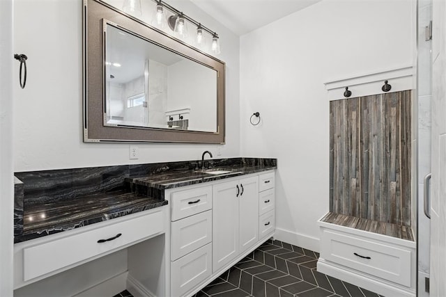 7217 Painted Sky Dr, Edmond, OK 73034 - bathroom with vanity, tile patterned flooring, and baseboards