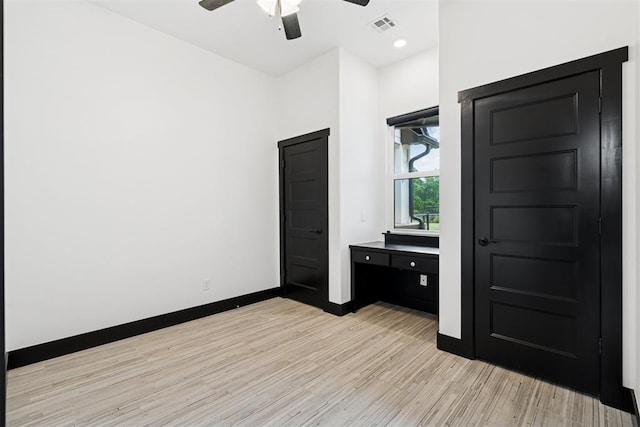 7217 Painted Sky Dr, Edmond, OK 73034 - unfurnished bedroom featuring light wood finished floors, baseboards, and a ceiling fan