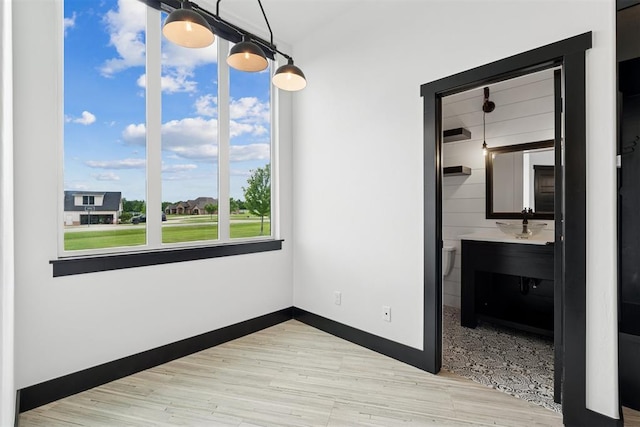 7217 Painted Sky Dr, Edmond, OK 73034 - unfurnished bedroom with wood finished floors and baseboards