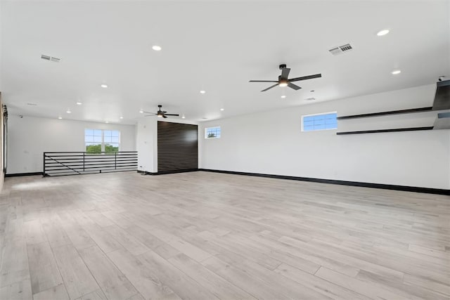 7217 Painted Sky Dr, Edmond, OK 73034 - spare room with ceiling fan, plenty of natural light, recessed lighting, and light wood-style floors