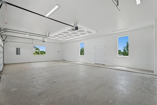 7217 Painted Sky Dr, Edmond, OK 73034 - garage with electric panel and a garage door opener