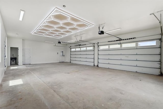 7217 Painted Sky Dr, Edmond, OK 73034 - garage with a garage door opener
