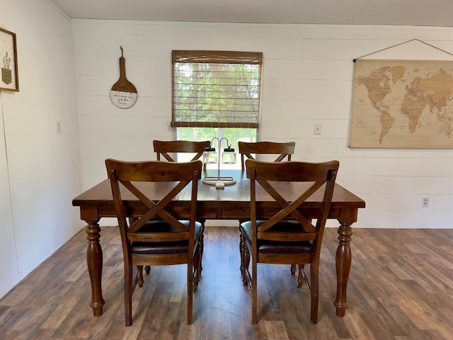 559 Poppy Rd, Broken Bow, OK 74728 - dining area featuring wood walls and wood finished floors
