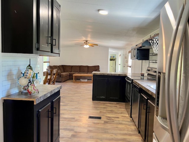 559 Poppy Rd, Broken Bow, OK 74728 - kitchen with dark cabinetry, stainless steel appliances, and a ceiling fan