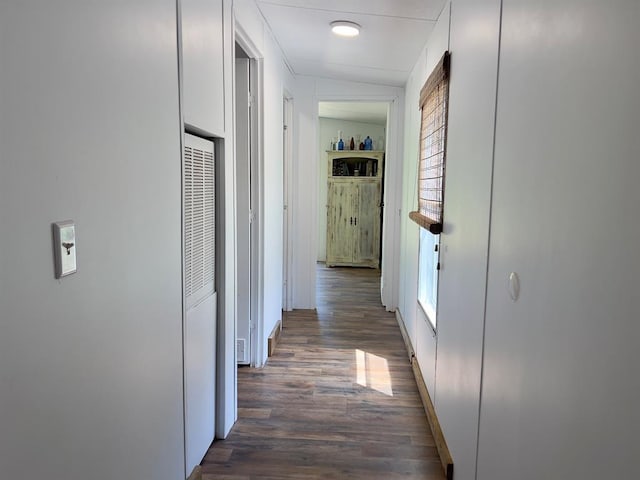559 Poppy Rd, Broken Bow, OK 74728 - corridor featuring a heating unit and dark wood-style floors