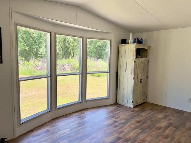 559 Poppy Rd, Broken Bow, OK 74728 - empty room featuring lofted ceiling, a textured ceiling, and wood finished floors