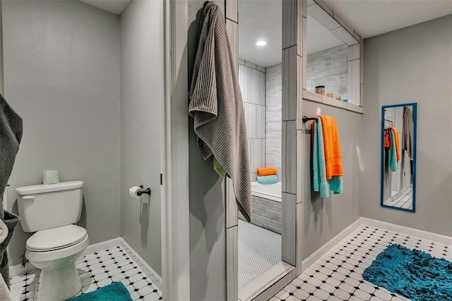 2107 NW 20th St, Oklahoma City, OK 73107 - bathroom featuring tile patterned floors, toilet, and baseboards