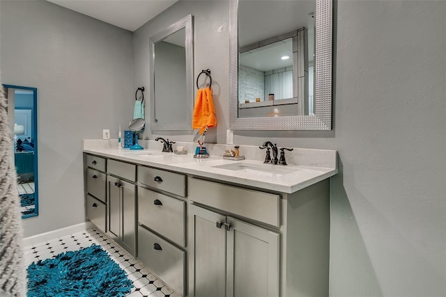 2107 NW 20th St, Oklahoma City, OK 73107 - full bath with double vanity and baseboards