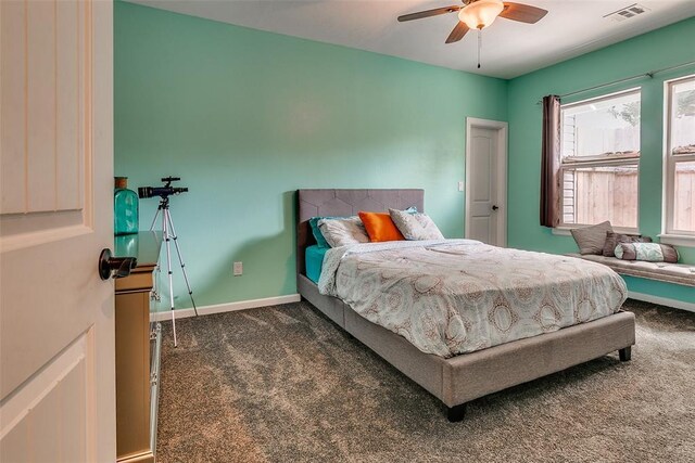 2107 NW 20th St, Oklahoma City, OK 73107 - bedroom with carpet flooring, baseboards, and a ceiling fan