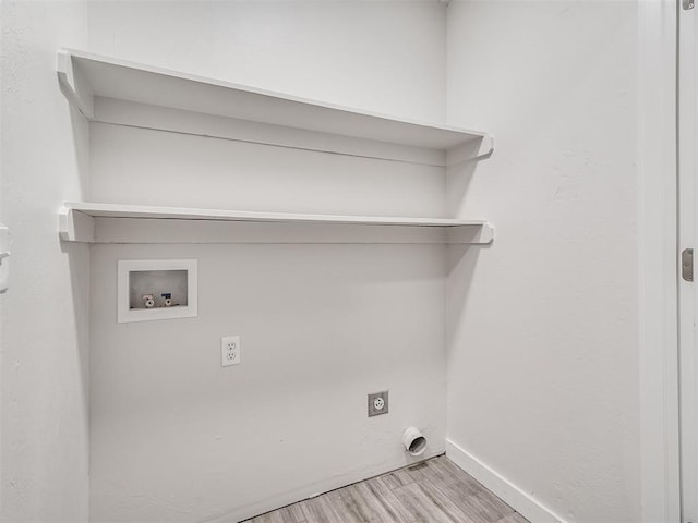 laundry area featuring hookup for an electric dryer, washer hookup, wood finished floors, and baseboards