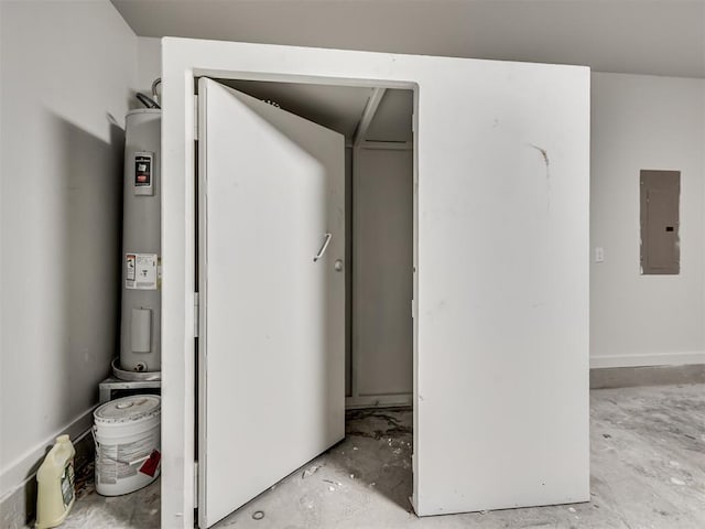 utility room featuring electric panel and electric water heater