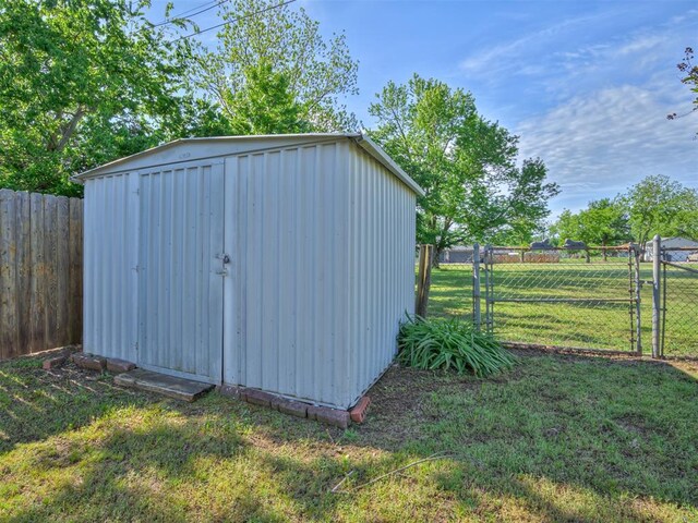 view of shed featuring a gate