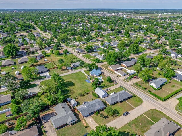 aerial view of property and surrounding area with nearby suburban area