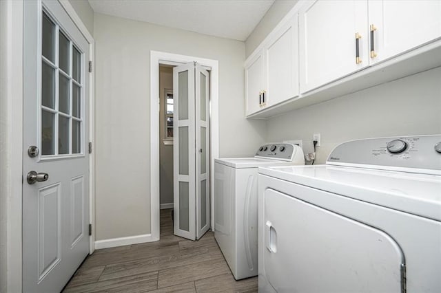 232 S Ranchwood Manor Dr, Oklahoma City, OK 73139 - washroom featuring independent washer and dryer, cabinet space, wood finished floors, and baseboards