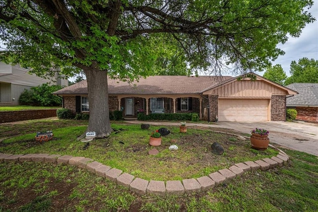 11125 NW 116th St, Yukon, OK 73099 - ranch-style home featuring a garage, driveway, and brick siding