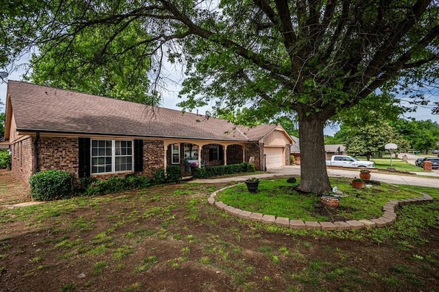 11125 NW 116th St, Yukon, OK 73099 - single story home featuring concrete driveway, a garage, brick siding, and roof with shingles