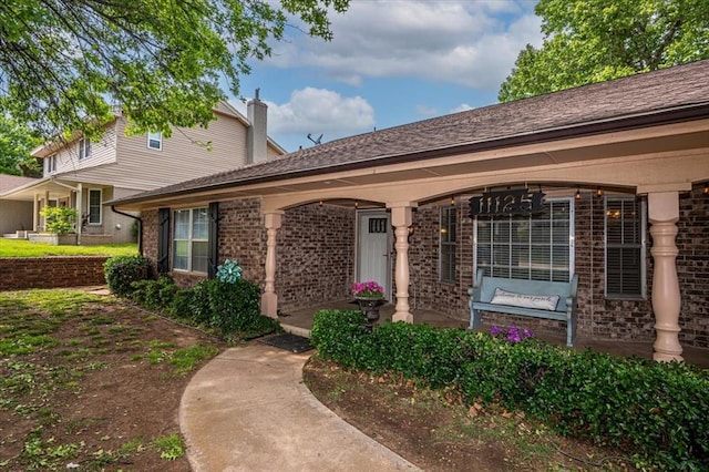 11125 NW 116th St, Yukon, OK 73099 - doorway to property featuring brick siding and a chimney