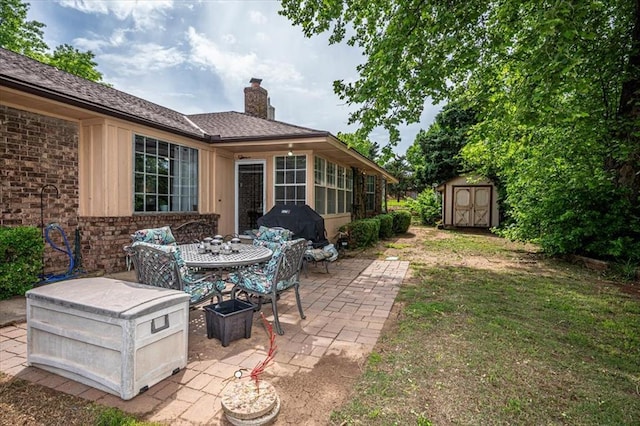 11125 NW 116th St, Yukon, OK 73099 - view of patio with a shed and an outdoor structure