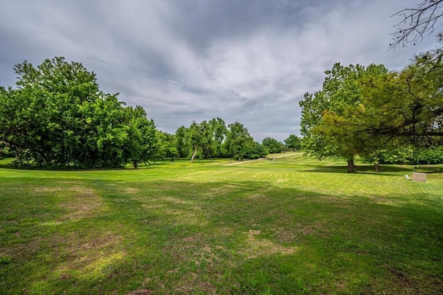 11125 NW 116th St, Yukon, OK 73099 - view of grassy yard featuring view of wooded area