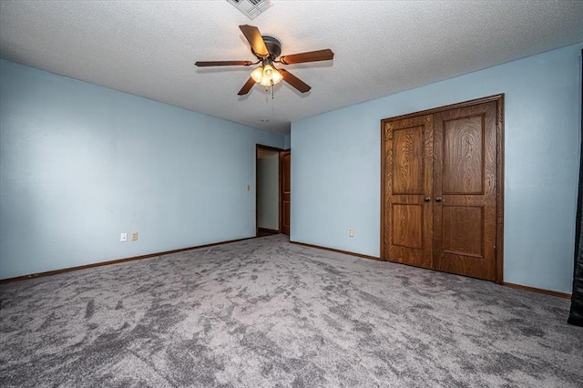 11125 NW 116th St, Yukon, OK 73099 - unfurnished bedroom with carpet flooring, baseboards, a textured ceiling, and ceiling fan